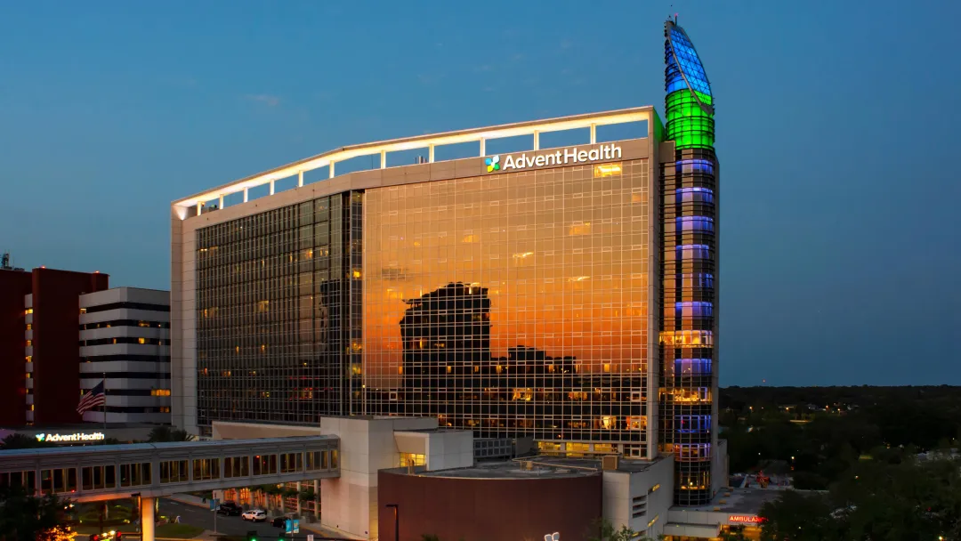 AdventHealth Orlando exterior in the evening.