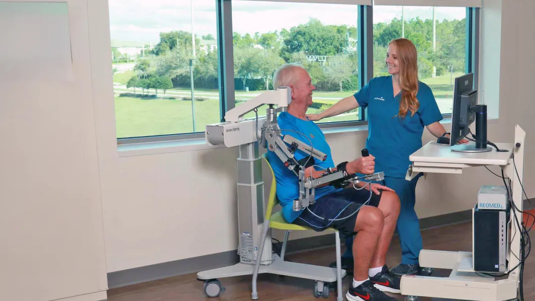 A Provider Helps a Patient with Neurological Physical Therapy