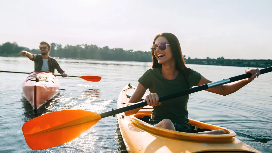Couple kayaking outdoors together.