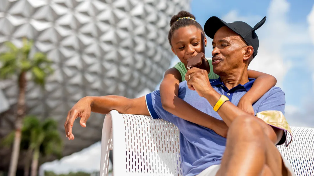 Father and Daughter at Epcot eating Ice Cream
