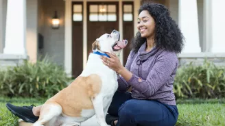 Woman playing with her dog.