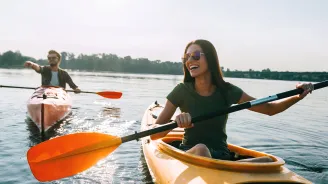 Couple kayaking outdoors together.
