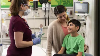 A young boy in a pediatric visit with his mother.