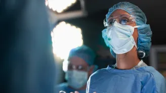 A woman surgeon in the operating room.