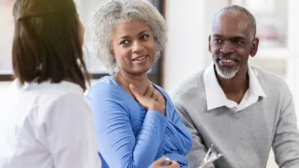 Couple learning they've been matched with a donor