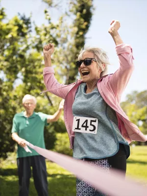 Elderly woman finishes breast cancer fundraising event