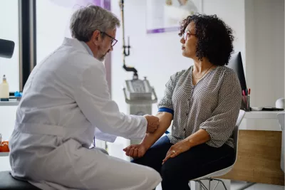 A Doctor Prepares His Patient's Arm for a Blood Draw.