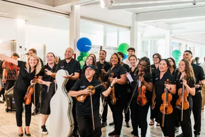 Group photo of members of the AdventHealth Orchestra.