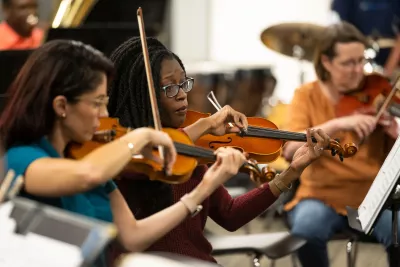 The AdventHealth employee orchestra rehearses.