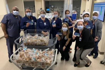 A group of nurses wearing masks with donations.