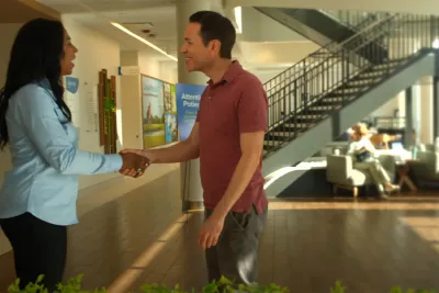 A patient shakes hands with an AdventHealth employee at a Health park facility.