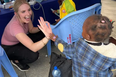 woman-high-five-young-child