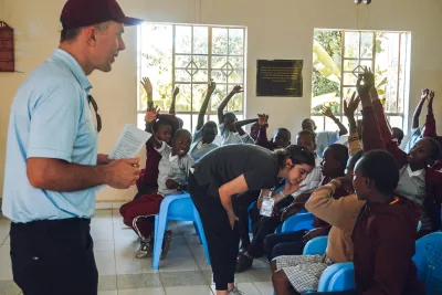 children-in-classroom-hands-raised