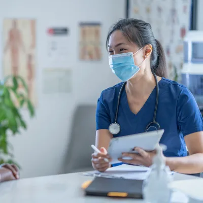 A Doctor Discusses with Her Patient Options for Her Health Care.