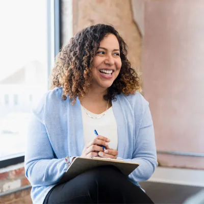 Woman taking notes about bariatric surgery
