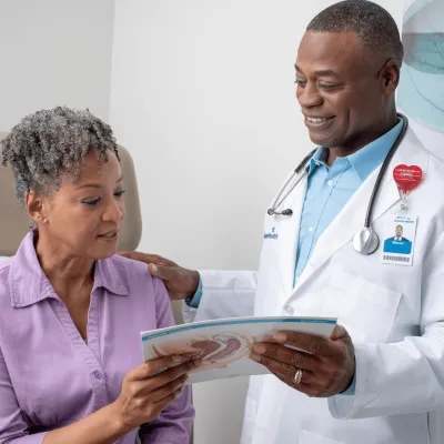 A Doctor Goes Over a Chart with a Patient