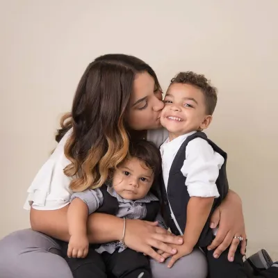 mother embracing her children