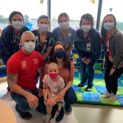 daniel webb with his daughter and staff at adventhealth for children