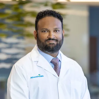 Headshot of Rishi Ramlogan, MD, FASMBS.