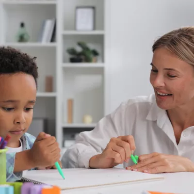 young-boy-coloring-adult-woman