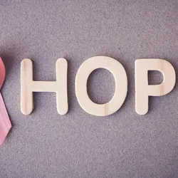 breast cancer logo next to the word hope