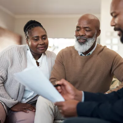 Couple talking with a specialist about insurance.