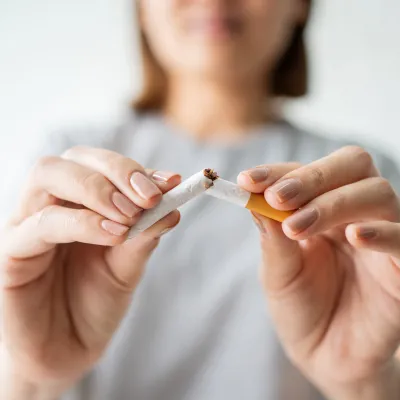 freedom-from-smoking-woman-breaking-cigarette