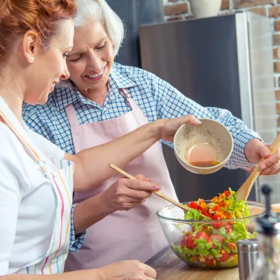 Two women cooking together