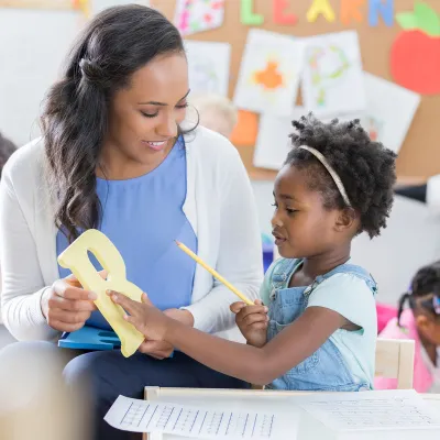 A Woman and child making arts and crafts