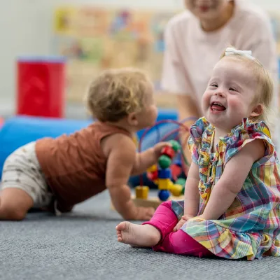 Little girl with down syndrome playing