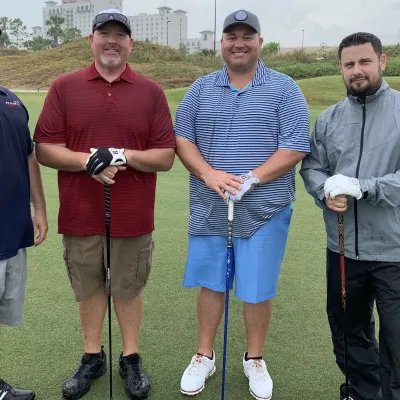 Four happy players at the AdventHealth Golf Classic