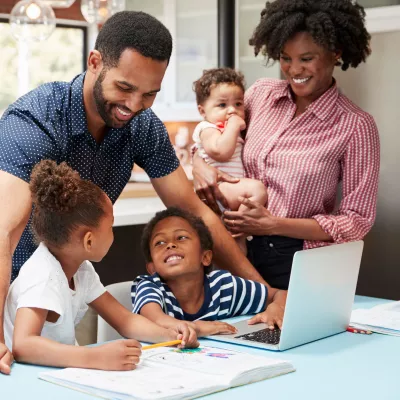 A family does homework together.