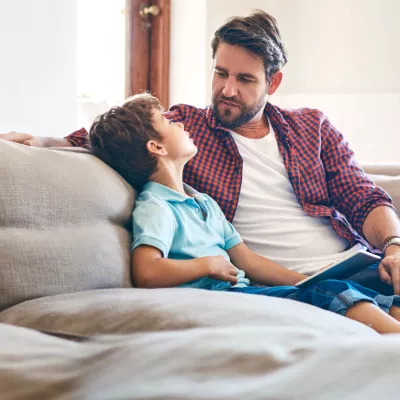 A father and son have a heart to heart conversation. 