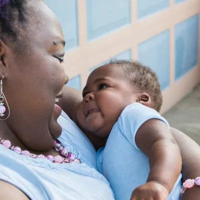 Katrina Grady holding a baby.