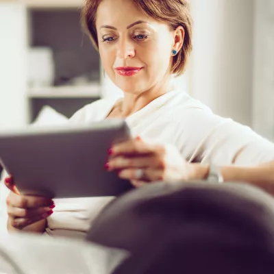 Older Female Reading on Couch
