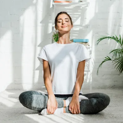 A woman taking a deep breath. 