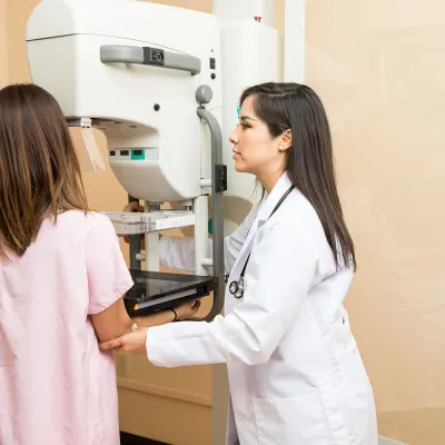 Woman having a mammogram.