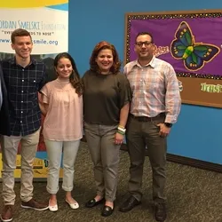 Group of people posing for a picture