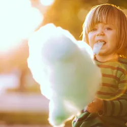 Kid eating cotton candy