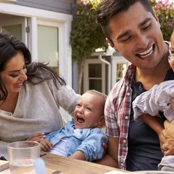 father holding child in his arms