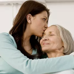 woman hugging another woman