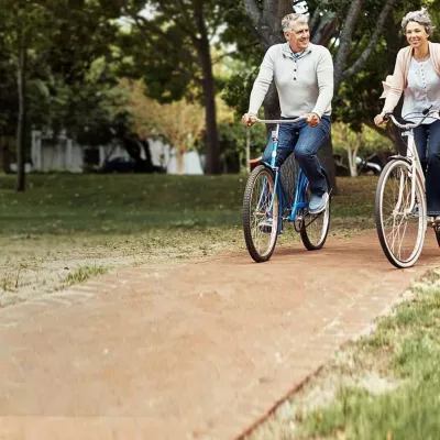 Old Couple Riding Bikes