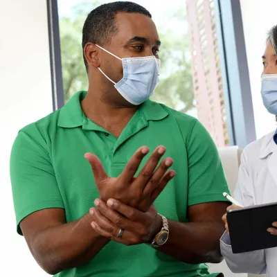 A man visiting his doctor.