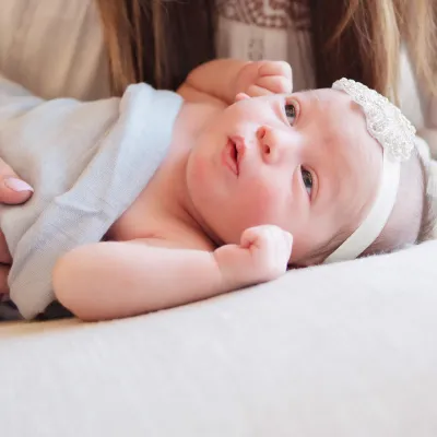 Mother with a newborn baby at home.