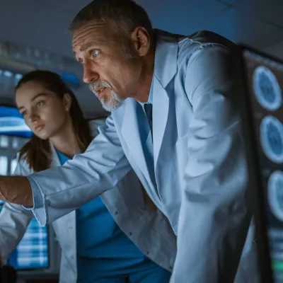 Physicians looking at a computer screen