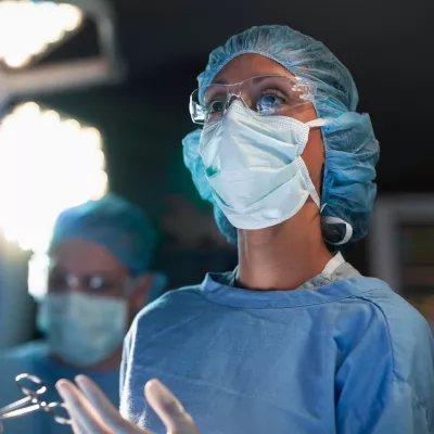 A woman surgeon in the operating room.