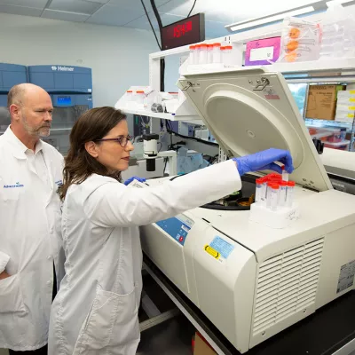 dr prayley looking over a study