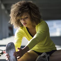 Athlete performing stretching exercises
