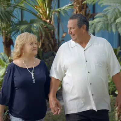 Susan and her husband walking together.