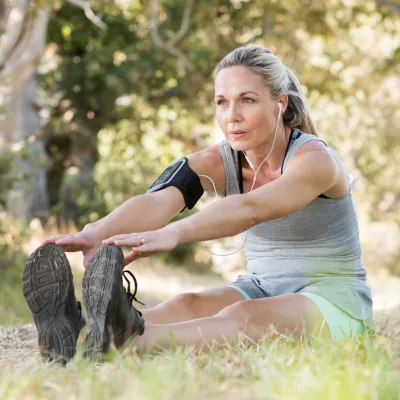 Person doing stretching exercises outdoors